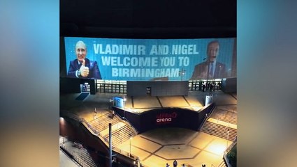 Led by Donkeys take over giant screen at Reform rally with pictures of Vladimir Putin and Nigel Farage