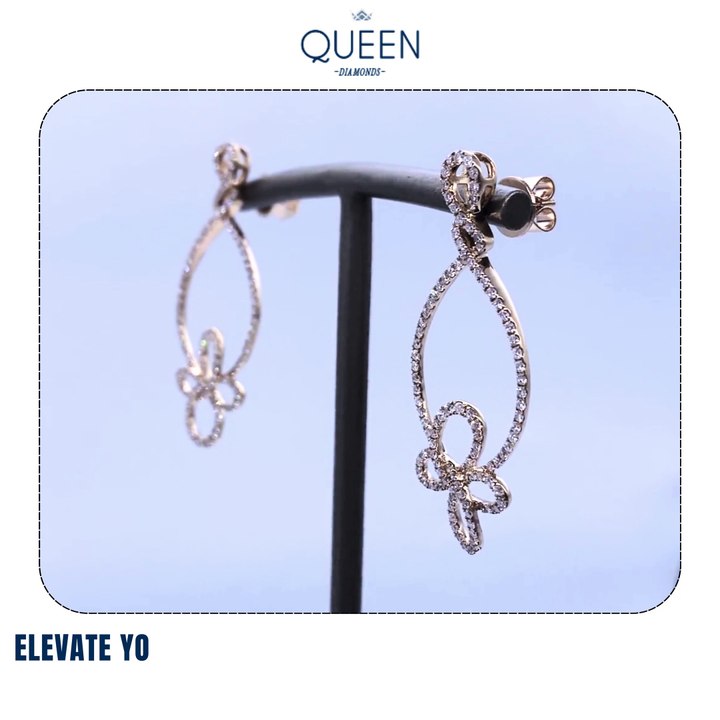 Elevate your elegance with our exquisite Teardrop & Floral Diamond Earrings from Queen Diamonds Dubai.