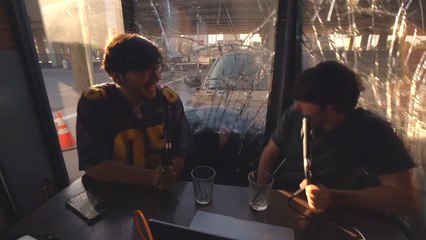 Vehicle Crashes Against Two Guys Podcasting Behind Glass Facade