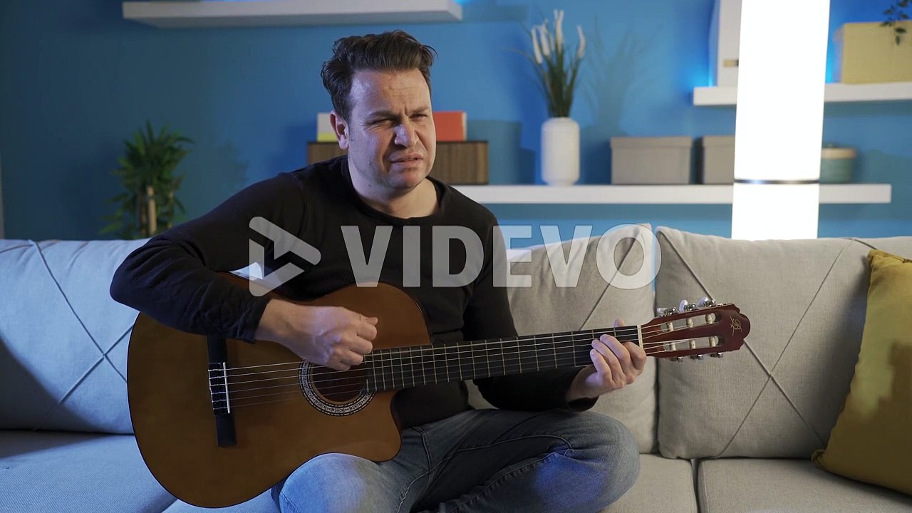 Depressed man at home, portrait of worried man with personal problems feeling stressed and helpless
