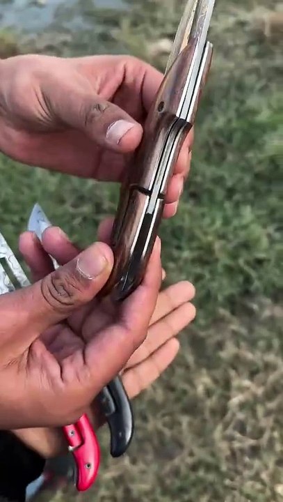 This is a damascus steel pocket folding knife