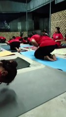 Women are practicing yoga in Kalyani.