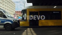 Urban Tram and a Police Car Drive By in Berlin, Germany