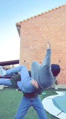 Boy's Head Gets Stuck in Girl's Sweater While Lifting Her