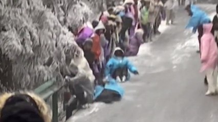 Icy slope sends hikers sliding down mountain