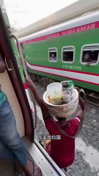 Bangladeshi people are traveling on the roof of a train