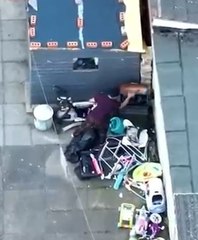 Drone captures binbag full of drugs being lobbed over fence as we raid home