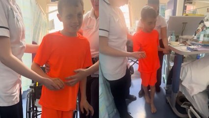 Boy takes first steps following brain surgery