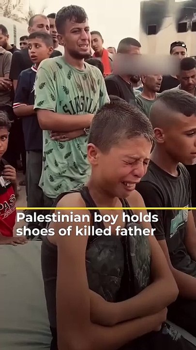 Palestinian boy holds shoes of killed father _ #AJshorts