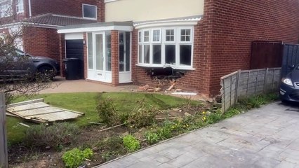 Casualty taken to hospital after car ploughs into home