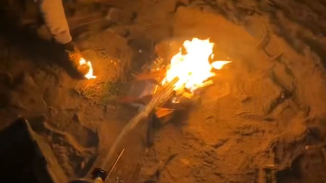 Campfire fun gone wrong: Gentleman realizes his shoe is on fire