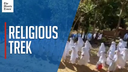 Catholic Church group walks through Stations of the Cross