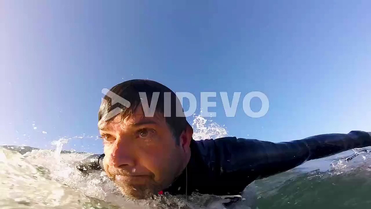 Surfer on Blue Ocean Wave Surfing Getting Barreled