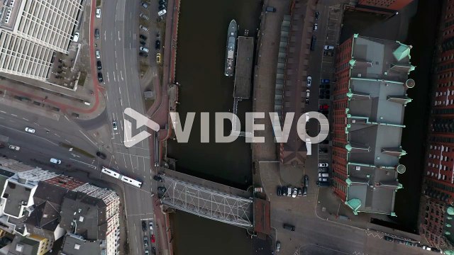Overhead top down aerial view of cars and traffic by Elbe river canal in Hamburg city center