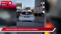 Skuterla kasksız tehlikeli yolculuk kamerada