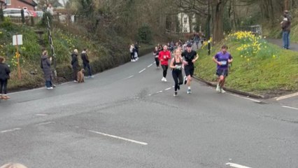 Mum becomes the ultimate hypewoman while cheering for daughter during half marathon run