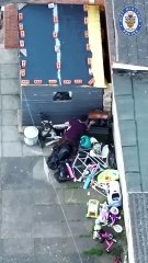 Drug dealer lobs bin bag of heroin over fence during police raid