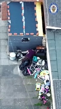 Drug dealer lobs bin bag of heroin over fence during police raid