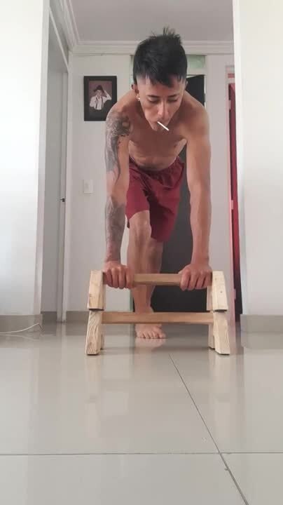 Wooden Bar Flips During Handstand, Causing Man Fall Hard on His Back