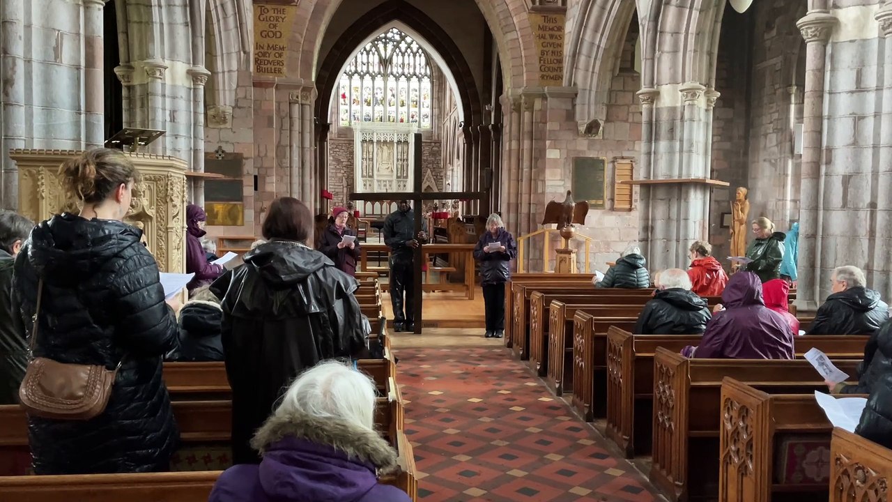 Bible reading at Crediton Parish Church during Good Friday Walk of Witness (Will Goddard, Crediton Courier)