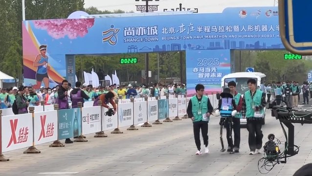Watch humans face robot competitors for first time in half marathon