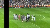 Leeds players dance on the pitch after promotion win