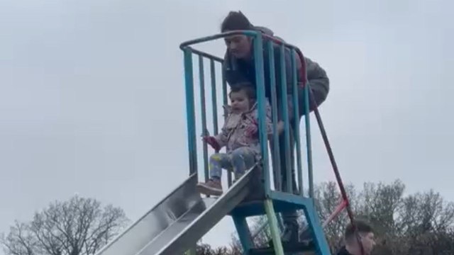 Gentleman swooped in to save a little girl from falling off the slide