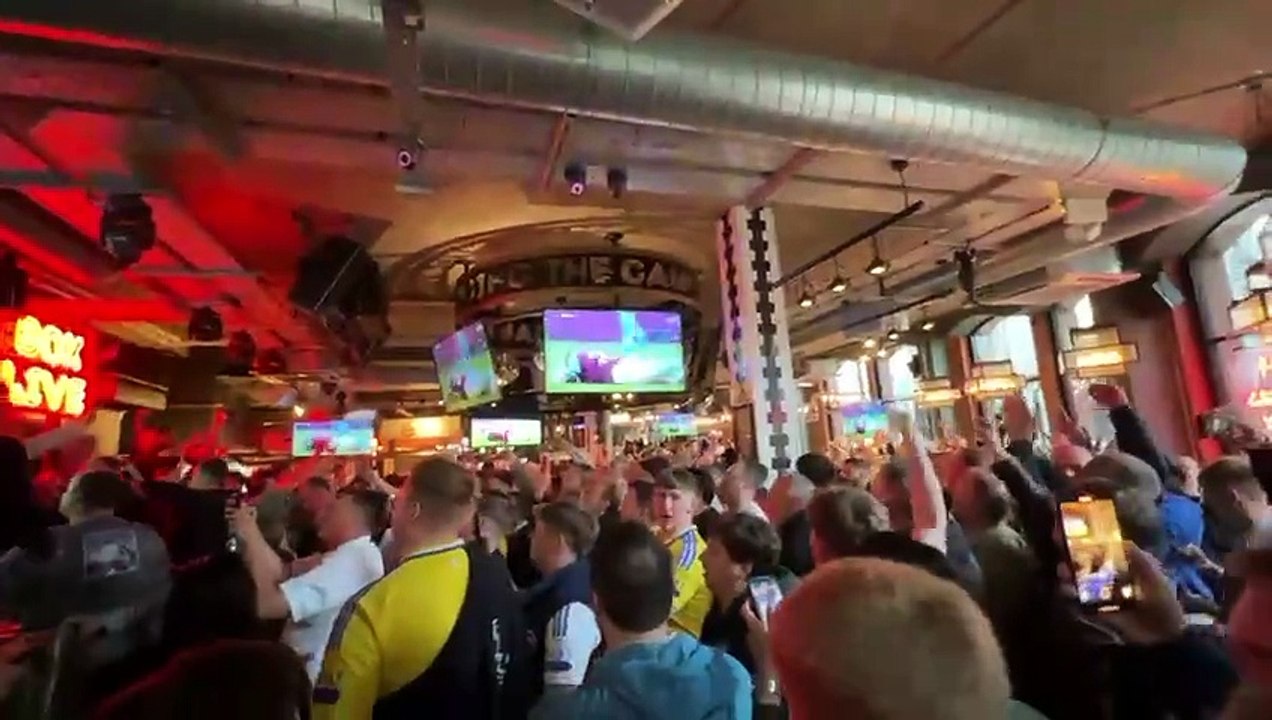 Leeds United fans celebrate promotion at city centre bar