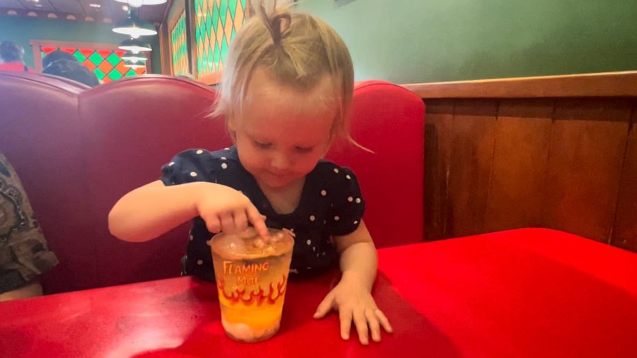 Trudy Trying a Flaming Moe at Moe's Tavern in Universal Studios Orlando