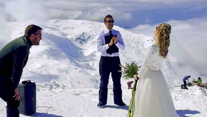 Bride skis down the aisle in her wedding dress to get married on mountain