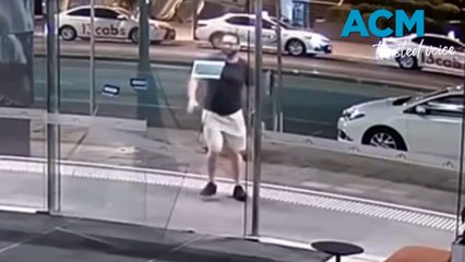 CCTV captures man kicking in Adelaide business door in early morning