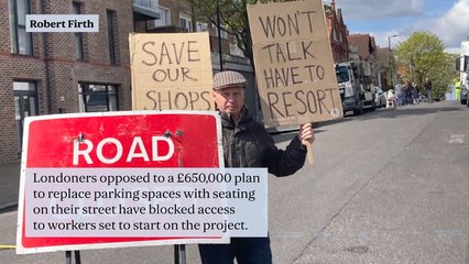 Residents block London street to stop controversial £650,000 plan to replace parking spaces with benches