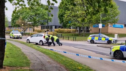 Police push white car off road at scene of collision in Rawmarsh, Rotherham