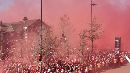 Liverpool fans celebrate as team bus arrives at Anfield ahead of Tottenham game