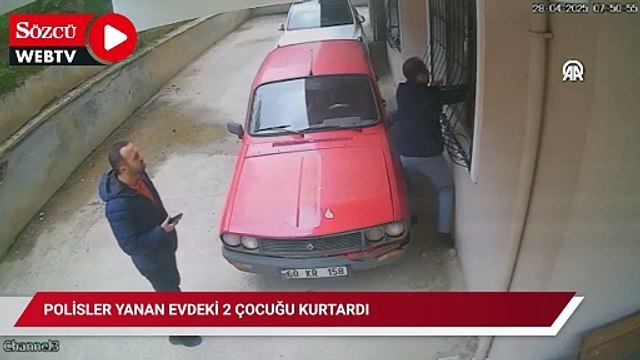 Polisler yanan evdeki 2 çocuğu kurtardı