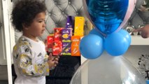 Little boy pops Easter balloon and dances with joy over chocolate surprise
