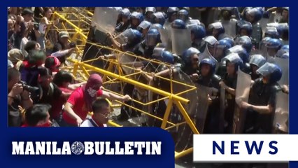Activists, workers clash briefly with police during a Labor Day rally in Manila