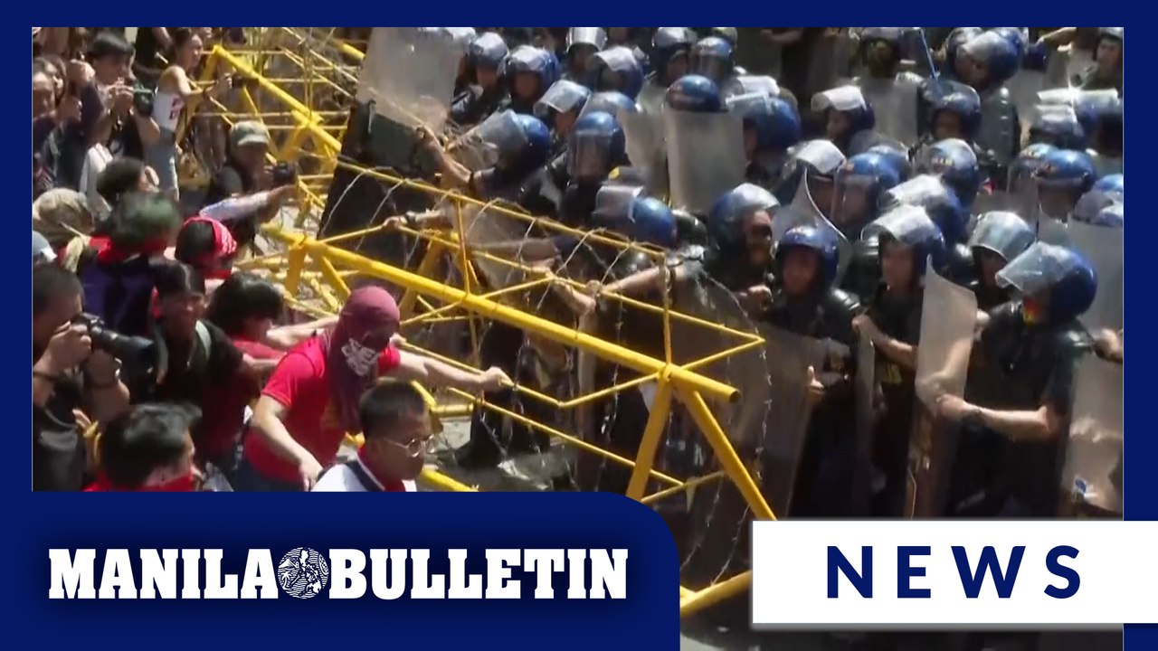 Activists, workers clash briefly with police during a Labor Day rally in Manila