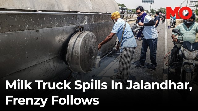 Milk container overturns in Jalandhar, locals rush to collect spilled milk
