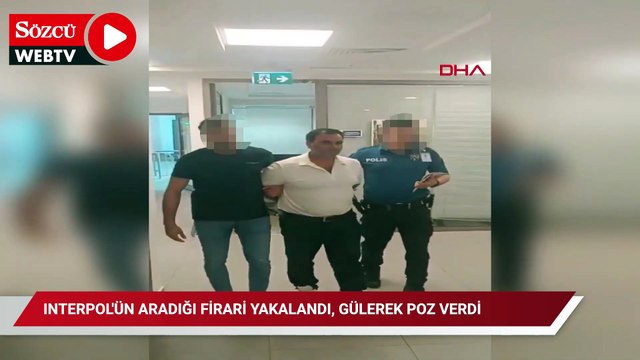 Interpol'ün aradığı firari yakalandı, gülerek poz verdi