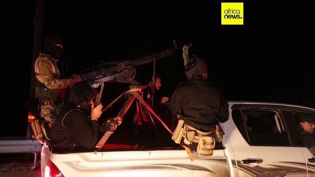 Syrian security forces and Druze gunman deploy in a Damascus suburb