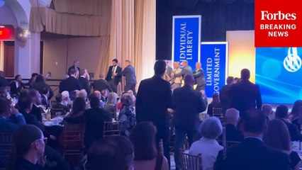 Protesters Rush Stage As Charles Koch Accepts Award From The Cato Institute In D.C.