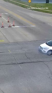 Smoking Car's Hood Bursts Into Flames at Intersection with Passenger Getting out Moments Before