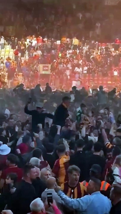 Bradford fans on the pitch after the 96th minute winner to secure their promotion to League One today.  Moments that will live with those Bradford fans forever. 👏