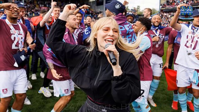 Chart-topping Noughties popstar belts out one of her famous hits with Burnley stars in dressing room as she makes shock appearance to celebrate their promotion to Premier League