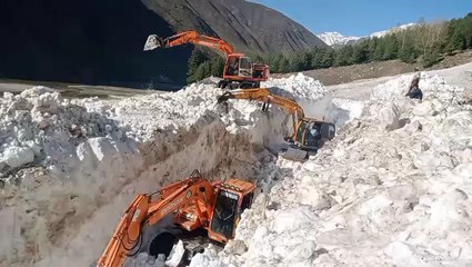 snow removing with excavator