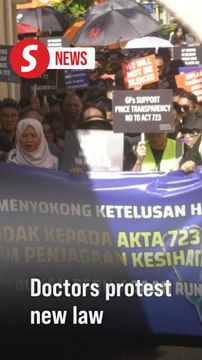 Doctors in black gather at PMO to protest against Act 723