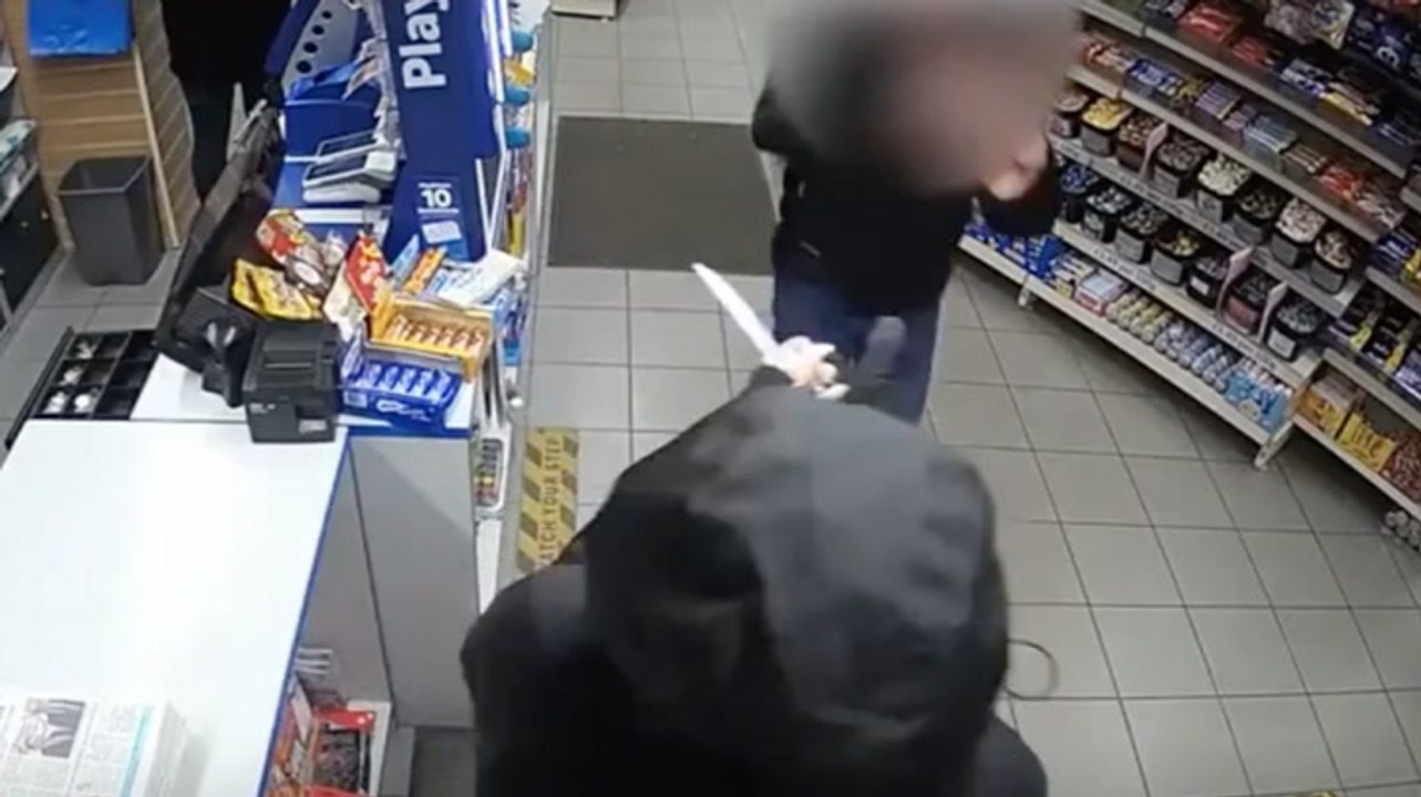 Shop worker confronts knife-wielding robber with bare hands after female colleague threatened