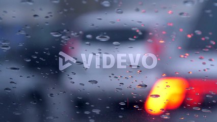 Defocused cars in line at border control, rainy weather conditions, in Europe