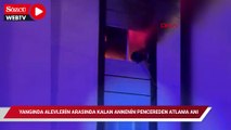 Yangında alevlerin arasında kalan annenin pencereden atlama anı kamerada